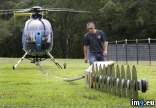 Tags: flies, giant, helicopter, lines, power, saw, trees, trim (Pict. in My r/PICS favs)